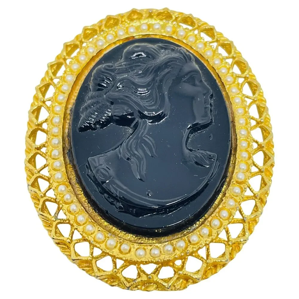 Vintage gold tone molded glass black cameo brooch